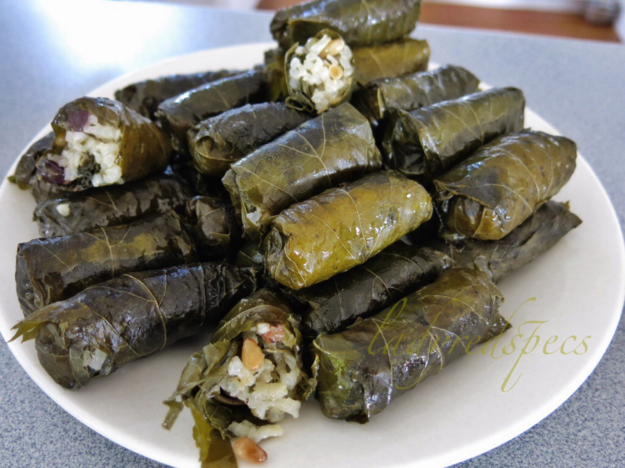 Greece Travel Secrets explains the long history of the Greek dish of dolmades, or stuffed vine leaves, which goes back to ancient Greece, and provides a recipe.